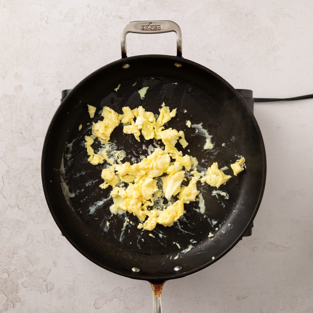 Scrambled eggs in a pan.