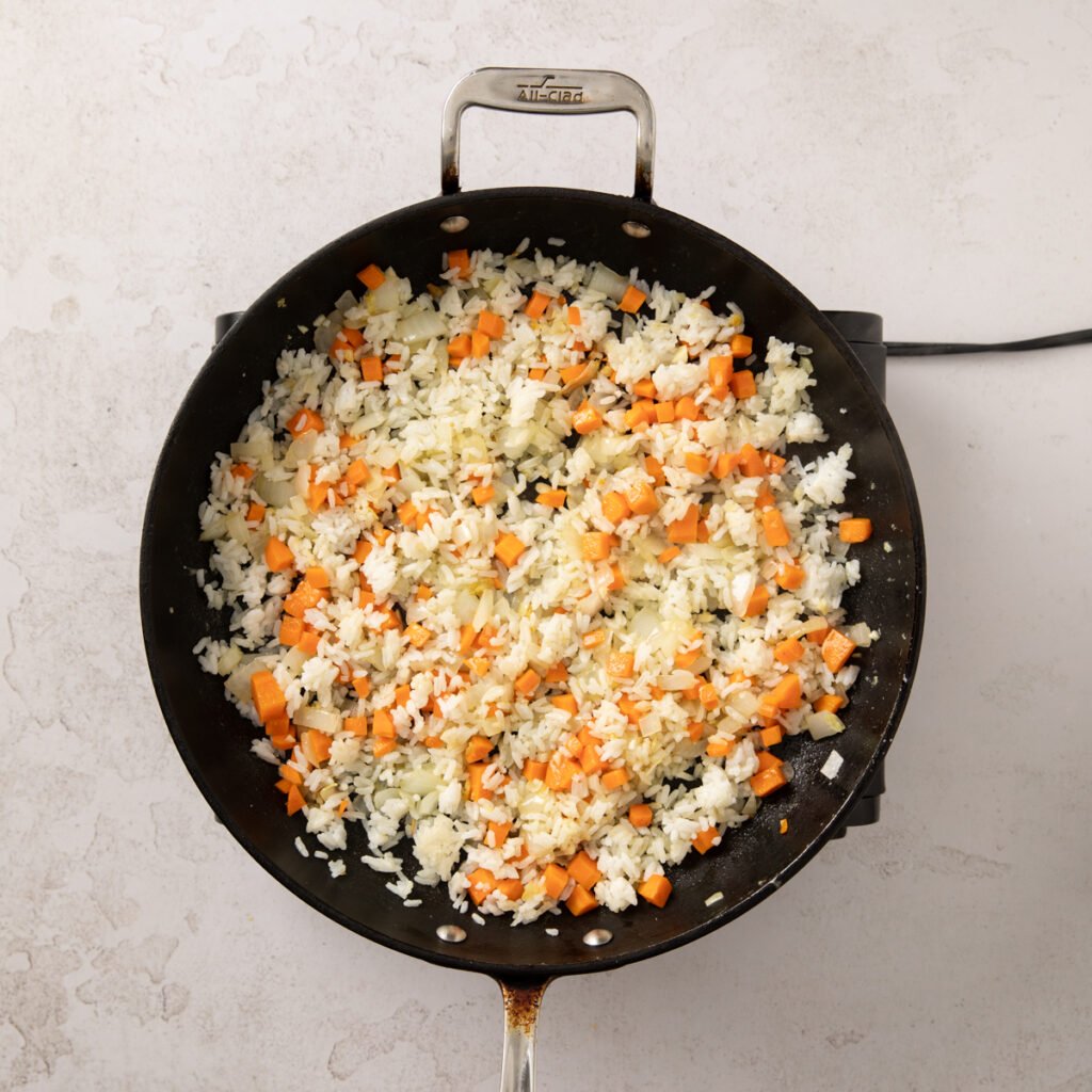 Day old rice added to the sauteed veggies.