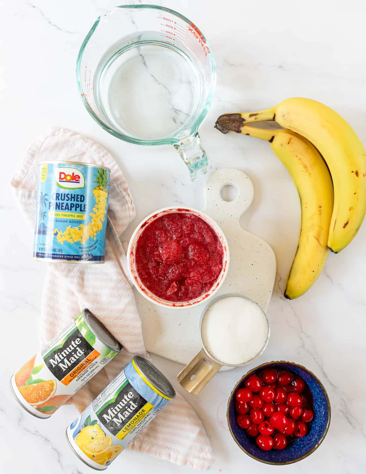 Ingredients on a table for making frozen fruit cups
