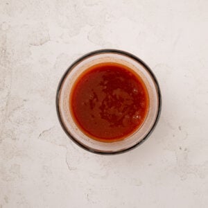 sweet and sour sauce in a small glass bowl.