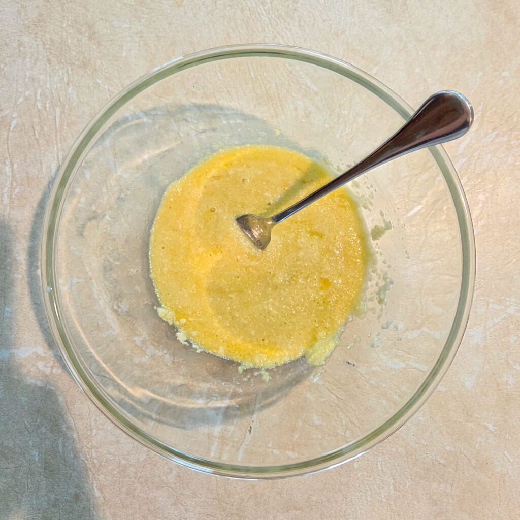 Start of a panade to use in turkey meatballs in a glass bowl.