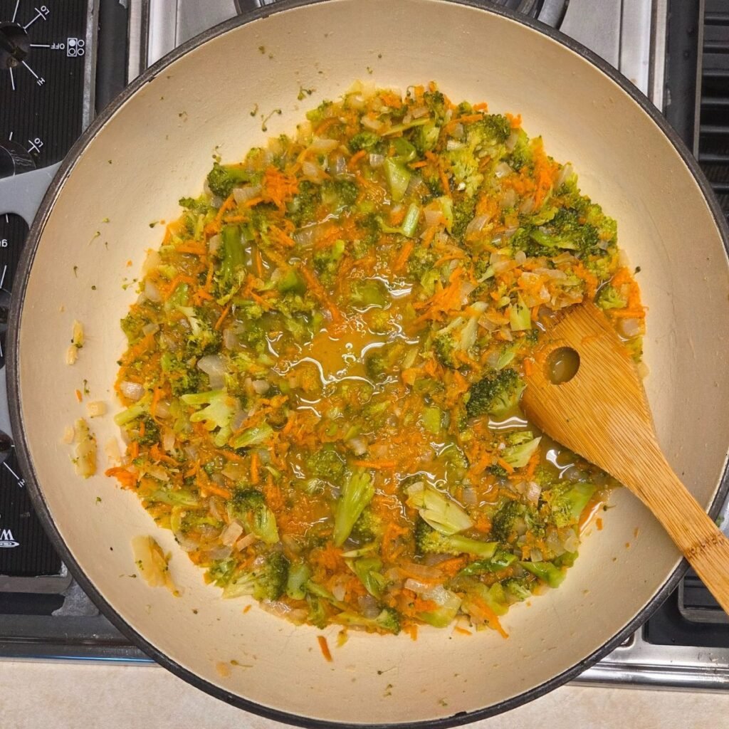 Shredded carrots added to the broccoli mixture.