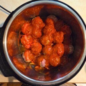 Sauce added to the top of the meatballs in the instant pot.
