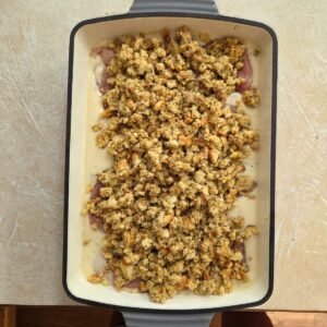stuffing sprinkled over chicken and cream sauce