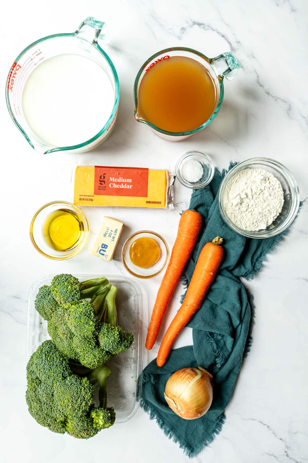 Ingredients shown are used to prepare Broccoli cheddar soup.