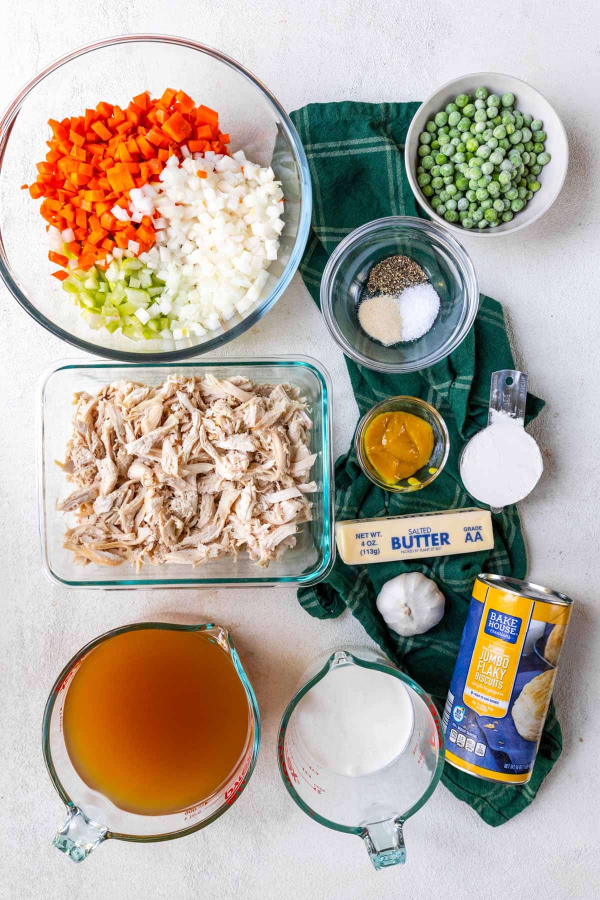 Ingredients for making chicken and biscuits casserole on a table 