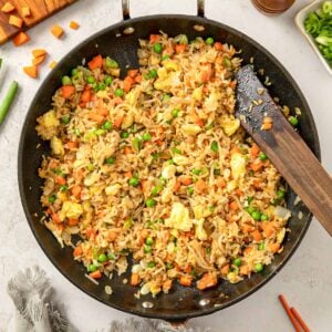 Top view of a wok with homemade vegetable fried rice.