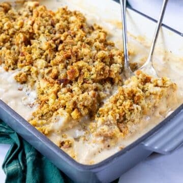 chicken in a cream sauce with stuffing over top, in a 9x13 baking dish
