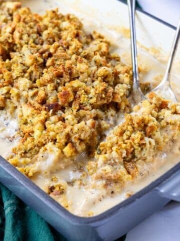 chicken in a cream sauce with stuffing over top, in a 9x13 baking dish