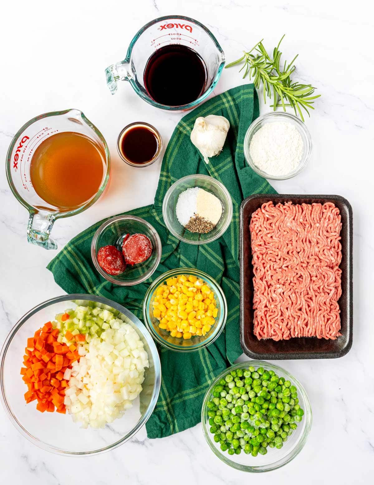 Ingredients shown are used to prepare shepherd's pie in bowls and cups.