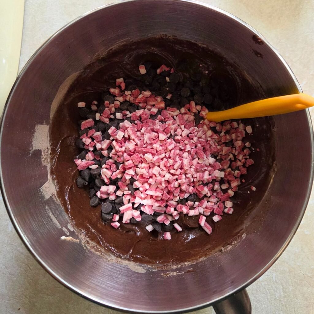 Crushed peppermint pieces and chocolate chips added to cake batter.