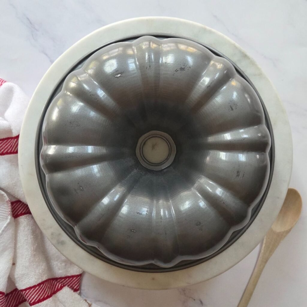 The bottom of a metal bundt pan.