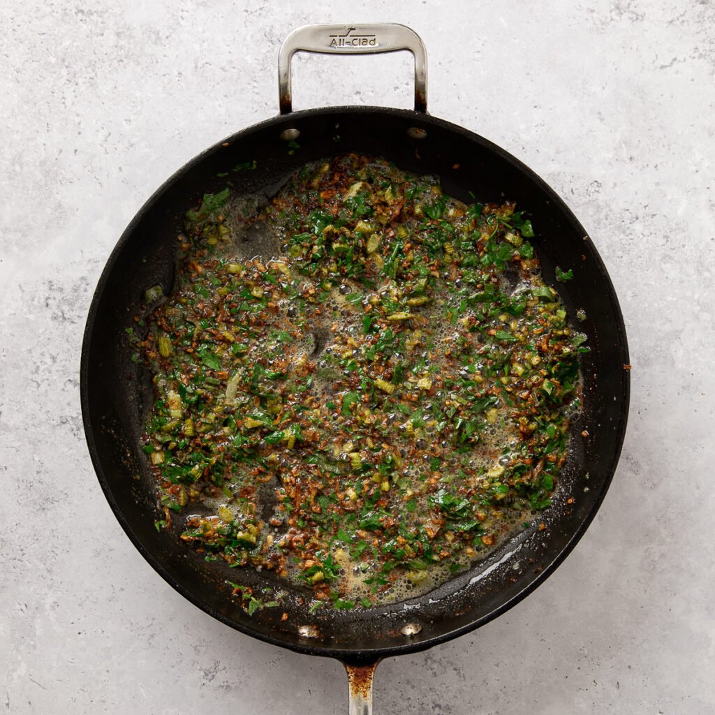 Seasonings and pancetta sauteeing in butter.