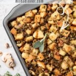 Pinterest pin with text overlay for savory herbed mushroom stuffing.