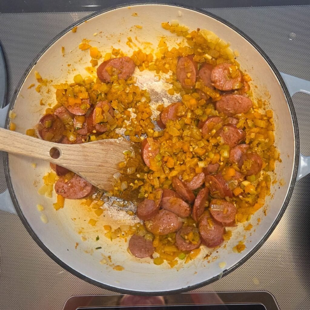 Garlic, seasonings added to the sausage mixture.