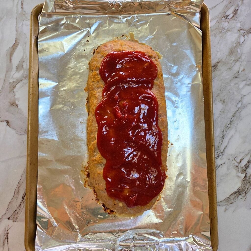 Sauce added to the top of the baked ground turkey meatloaf.