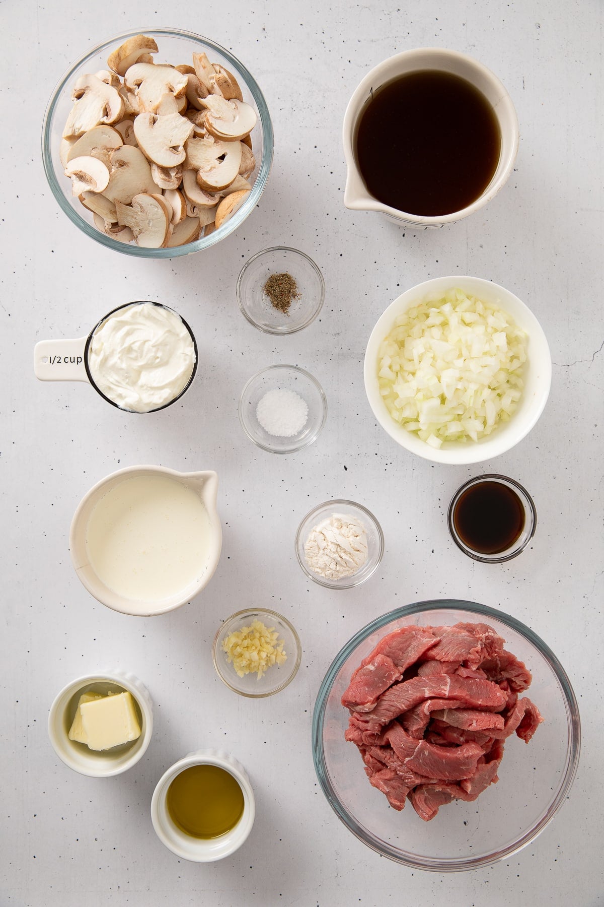 Ingredients measured out and shown to use to prepare beef stroganoff.