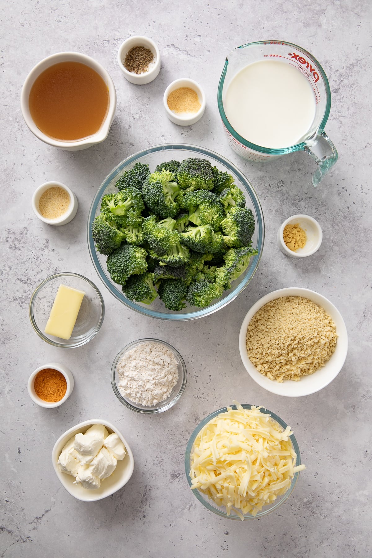 Ingredients shown are used to prepare downhome broccoli cheese casserole.