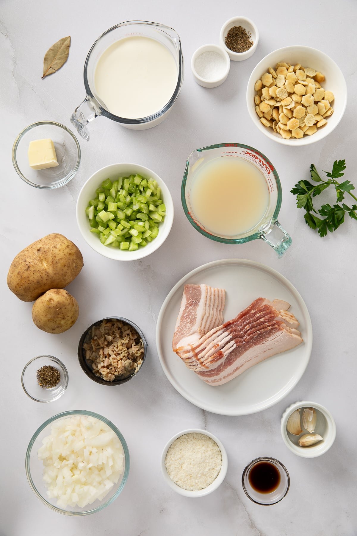 Ingredients shown are used to prepare clam chowder.