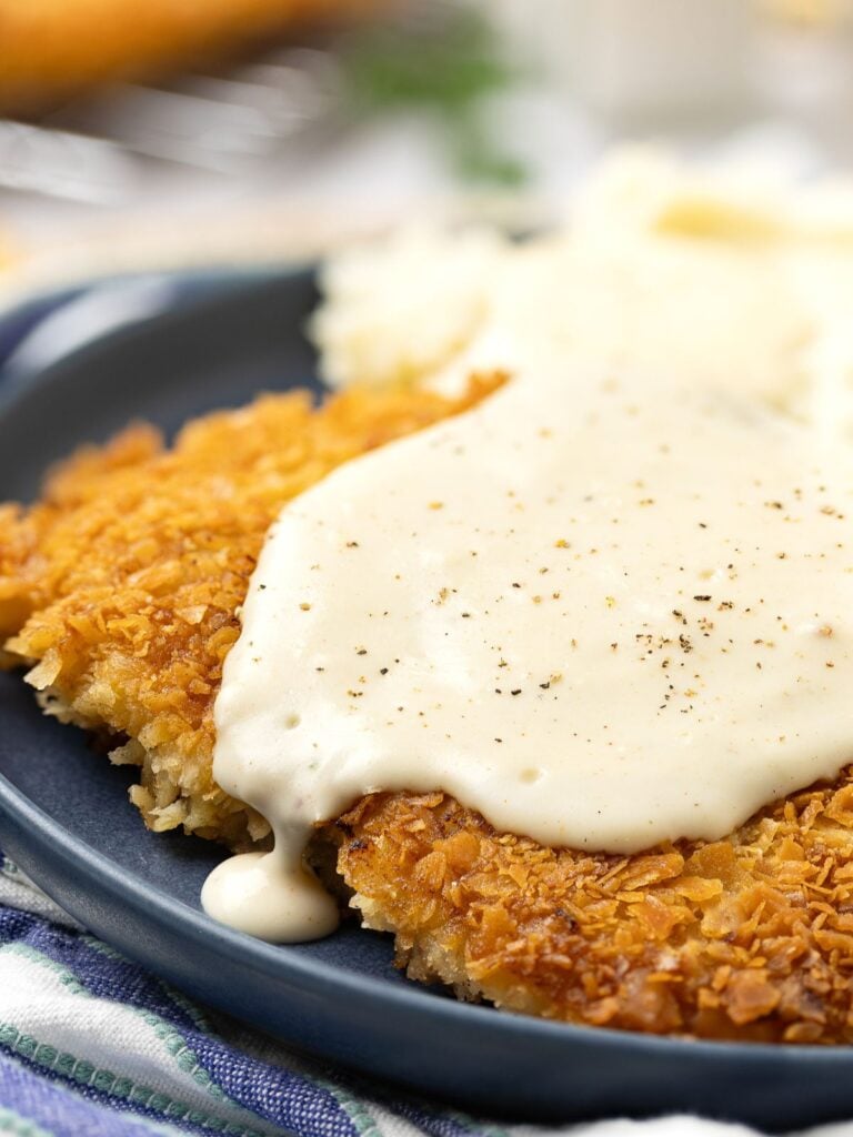 Country fried steak served on a plate.