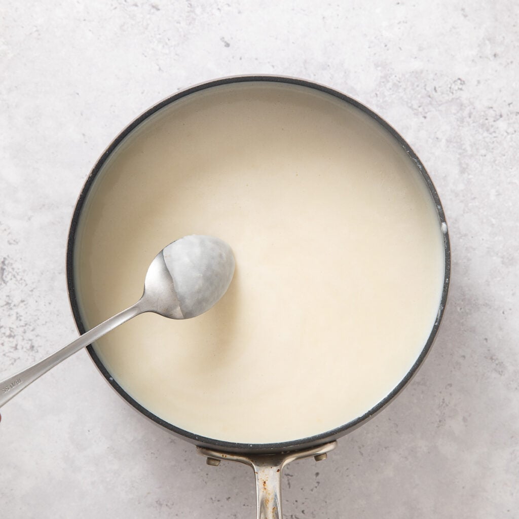 White cheese sauce in a skillet.