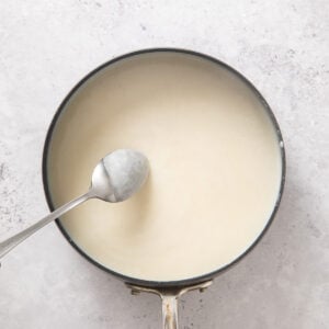 White cheese sauce in a skillet.