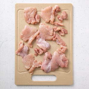 Chicken thighs with salt and pepper.