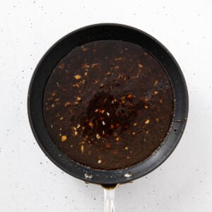 Thickened teriyaki sauce in a skillet.
